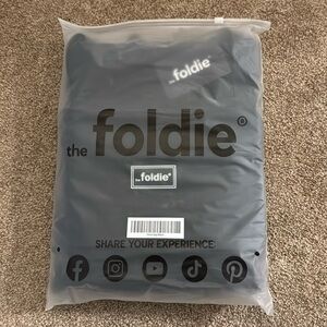 BRAND NEW black The Foldie travel bag
